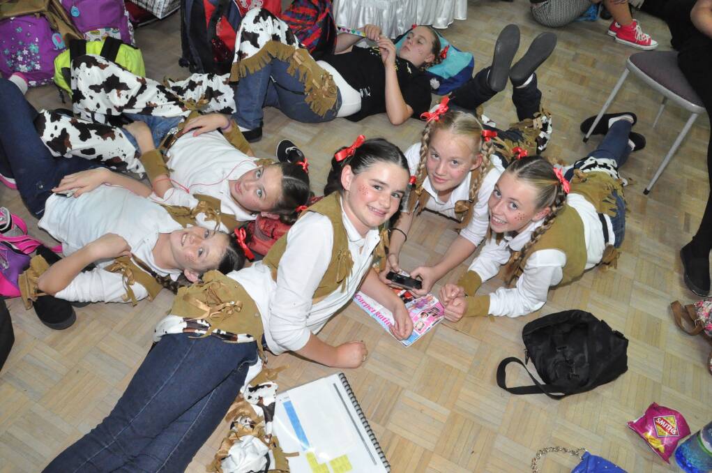 Performing on stage at the Schools Spectacular was not only exhausting, but left slabs of time out of the spotlight. Dubbo Public School dancers Bella Monaghan, Tamikah Melville, Lucy Power, Sam Galway and Eliza Bryan made the most of the time relaxing and playing games. 
	Photo contributed
