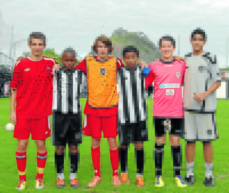 Cameron Kopp, Kobe Rapley and Jarrod Miller with some of the Botafogo players in Rio de Janeiro.