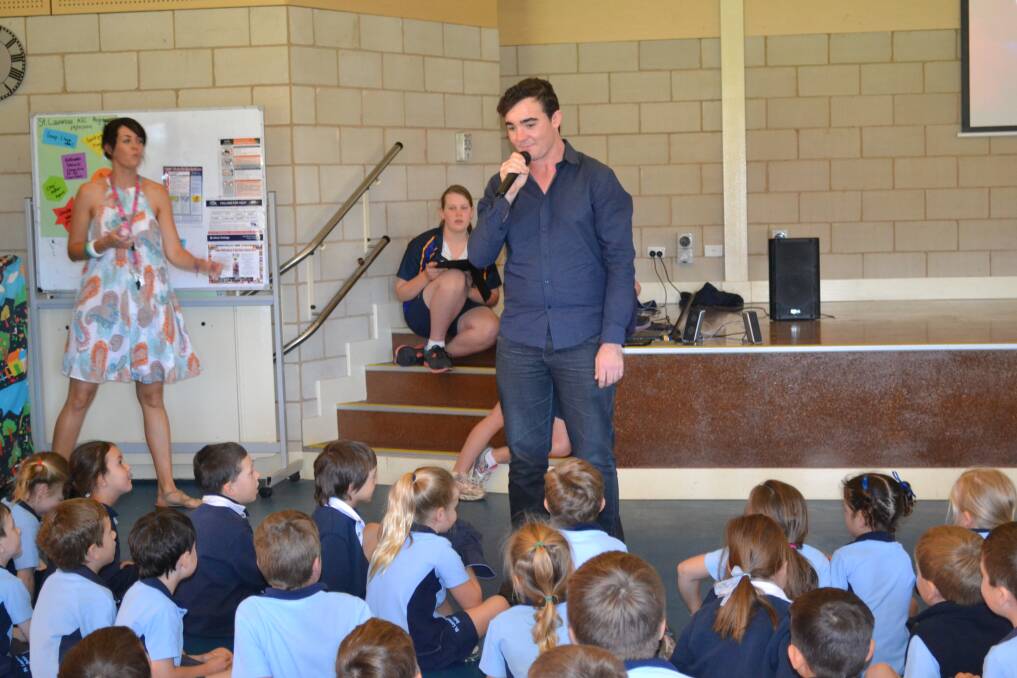 The X-Factor Australia's Jason Owen, performing in front of a group of St Laurence's Primary School students in Dubbo recently. Photo: ABANOB SAAD
