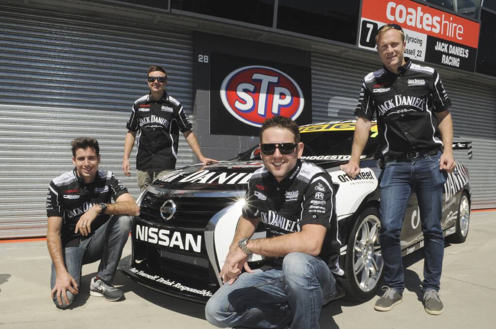 SPEED: Rick (front left) and Todd Kelly (right) along with co-drivers David Russell (back left) and Karl Reindler (back right) after the Jack Daniels Racing Team arrived in Bathurst yesterday. Photo: CHRIS SEABROOK