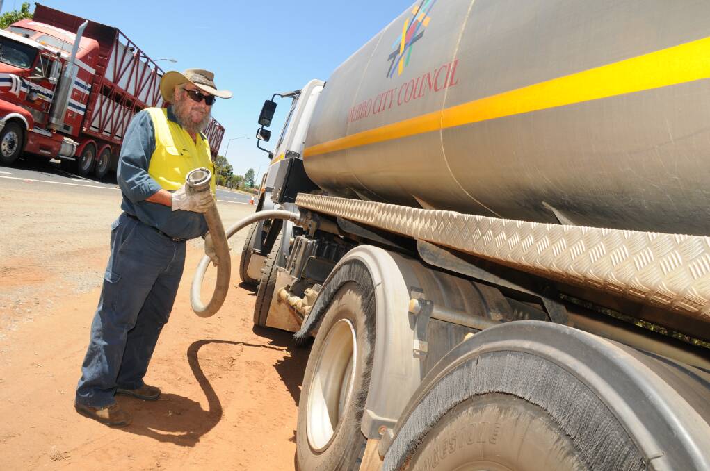 Dubbo City Council's Peter Reynolds with one of the water tankers. Photo: LISA MINNER