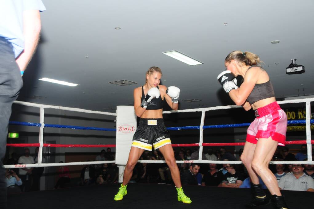 Lauryn Eagle sizing up her opponent Nicki bigwood during theri fight on Friday night. Photo: HOLLY GRIFFITHS.