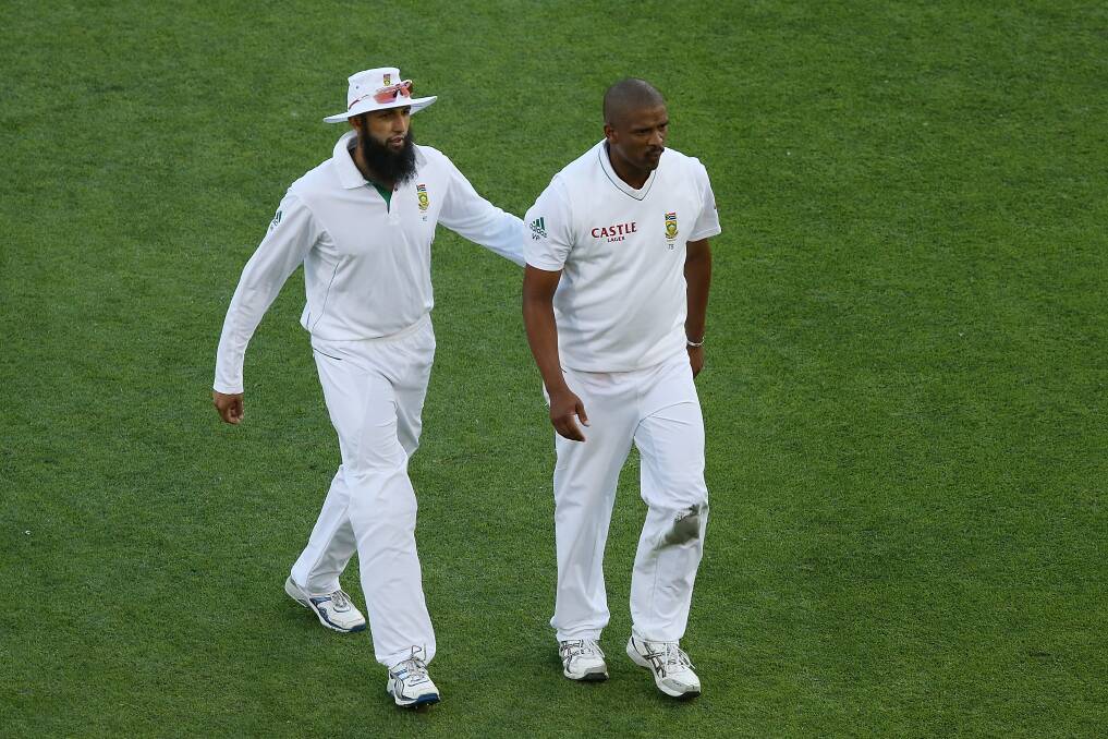 Hashim Amla and Vernon Philander of South Africa leave the field at end of play during day three of the First Test match between Australia and South Africa at The Gabba in Brisbane, Australia. Photo by Chris Hyde/Getty Images