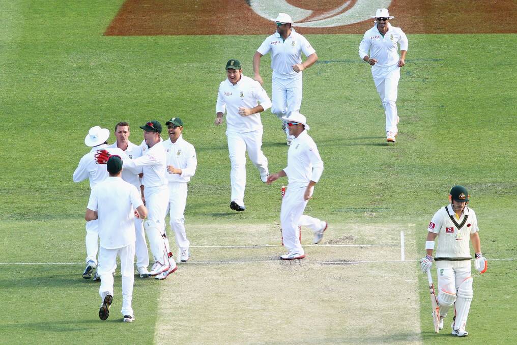 Dale Steyn of South Africa celebrates the wicket of David Warner of Australia during day three of the First Test match between Australia and South Africa at The Gabba in Brisbane, Australia. Photo by Mark Kolbe/Getty Images