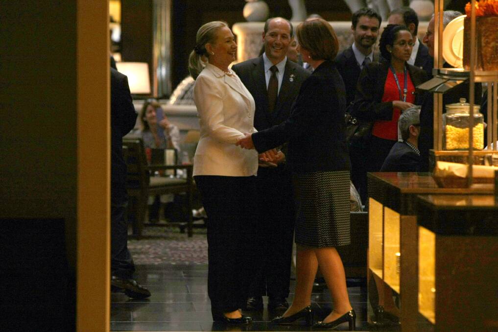 Australian Prime Minister Julia Gillard and US Secretary of State Hillary Clinton greet each other in the bar of the Hyatt Hotel prior to the Australia-United States Ministerial Consultations, in Perth, Australia. Photo by Colin Murty - Pool Getty Images