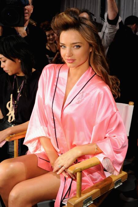 Victoria's Secret Angel Miranda Kerr prepares backstage at the 2012 Victoria's Secret Fashion Show at the Lexington Avenue Armory in New York City. Photo by Jamie McCarthy/Getty Images