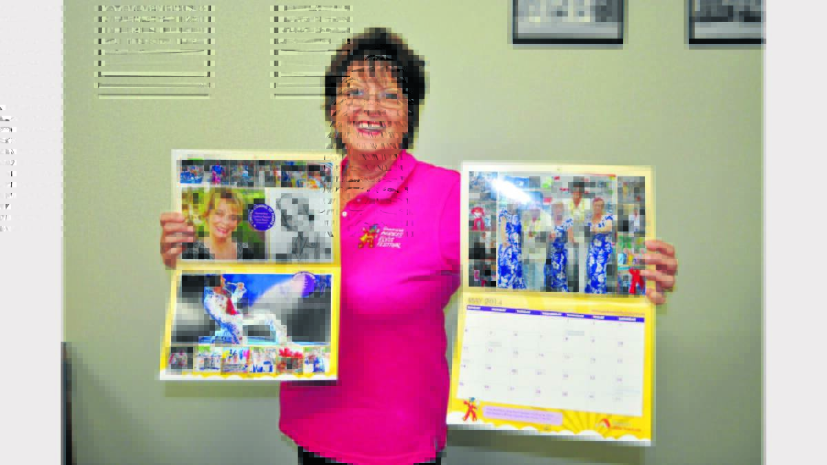 Allison Howlett proudly displays the offical Elvis Festival calendar, which are available at a number of Parkes businesses.  Photo:  Roel ten Cate.