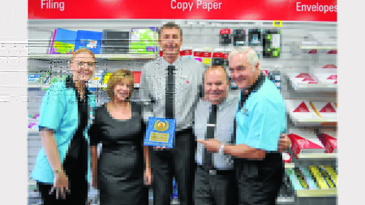 Winner of the Best Dressed Staff was Parkes Post Office.  Gail Bartley and Bob Steel present the award to Lyn Torrens, David Jolly and Steve Torrens.                        0113elvispost1 