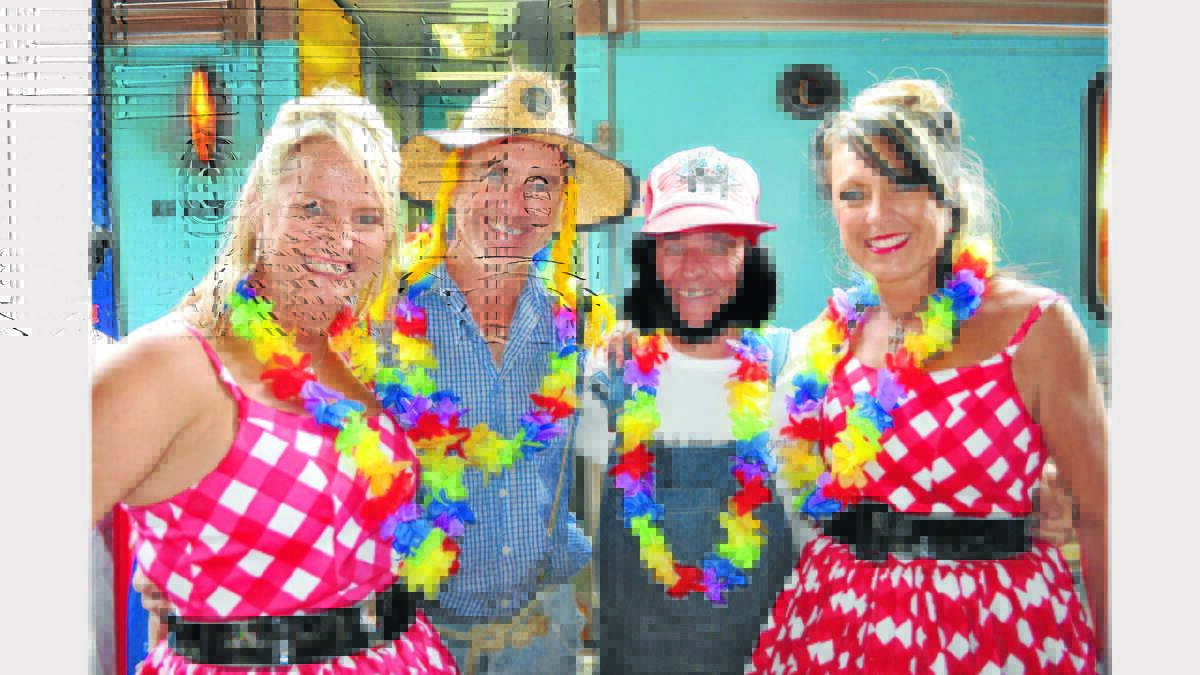 The theme is Kissin Cousins for the Elvis Festival and Greg Williamson (left) and Anthony Hasset said they fitted in beautifully. They are pictured with regular Festival attenders, Jenny Perkins (left) and Justine Leeke. All arrived on the Elvis Express.
