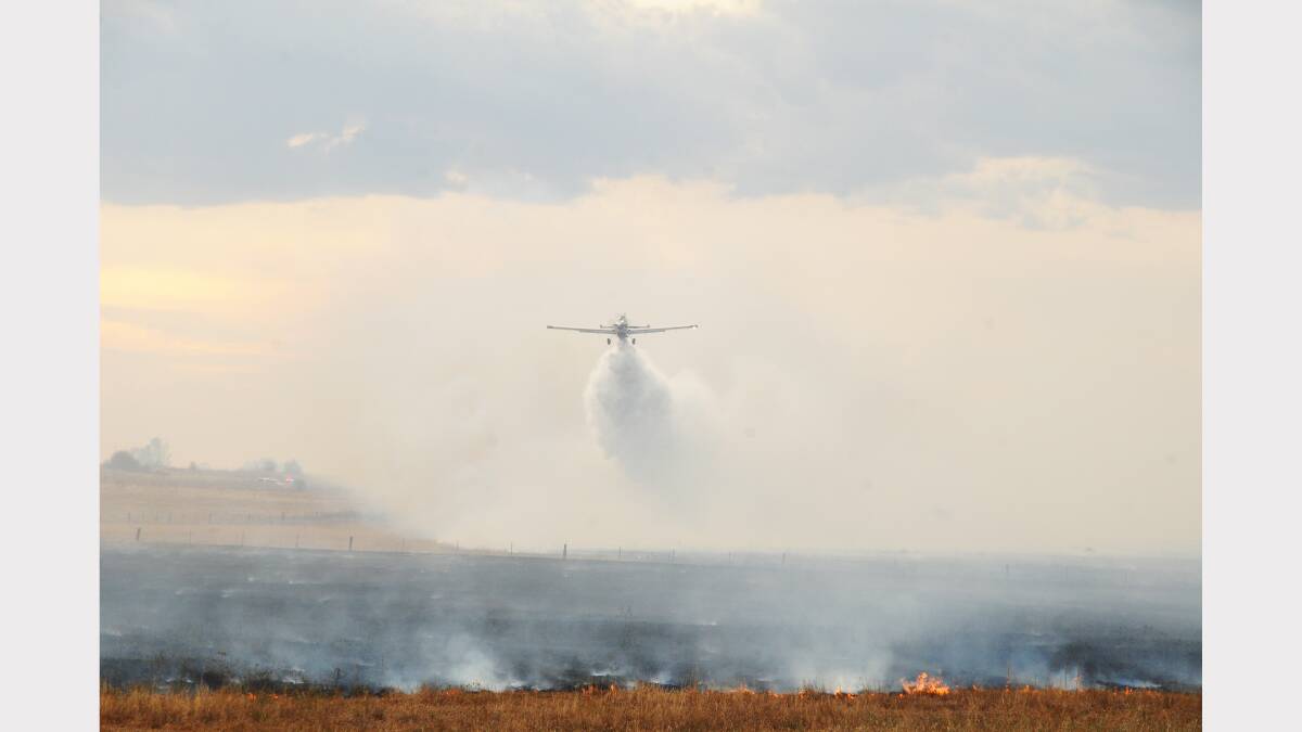 A fixed-wing aircraft is deployed to a fire in West Dubbo on Wednesday afternoon that could have wiped out property but for a fast and efficient response from the Orana team of the NSW Rural Fire Service, its volunteers and Fire and Rescue NSW. 	Photo: AMY MCINTYRE