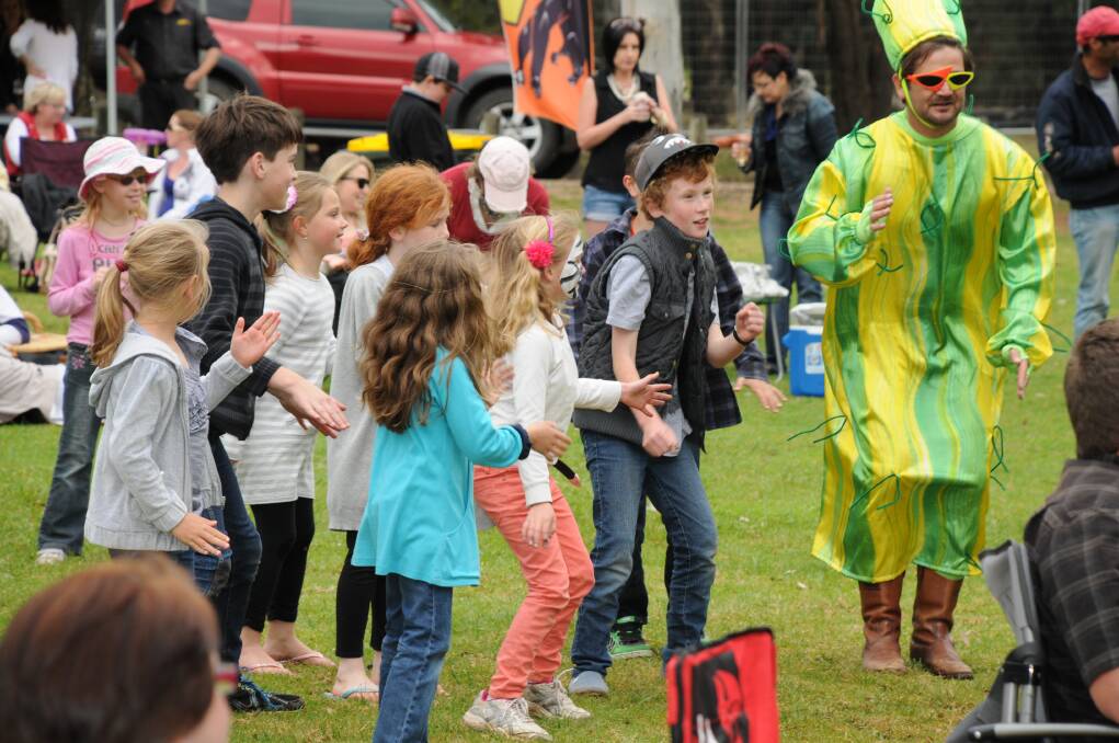 Mumblepants guitarist and cactus fan Phil Cameron leading kids at Zoo Grooves with some very funky dance moves while they were entertained by Sydney band Jelly Bean Jam, who entertained the crowd before headline act Ian Moss hit the stage. Photo: LISA MINNER