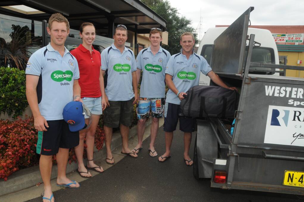 Jordan Moran, Kellsey Ferguson (physio), Jason Ryan, Declan Hoare and Greg Buckley load their gear into the trailer for their trek to Wagga Wagga yesterday. 	Photo: BELINDA SOOLE